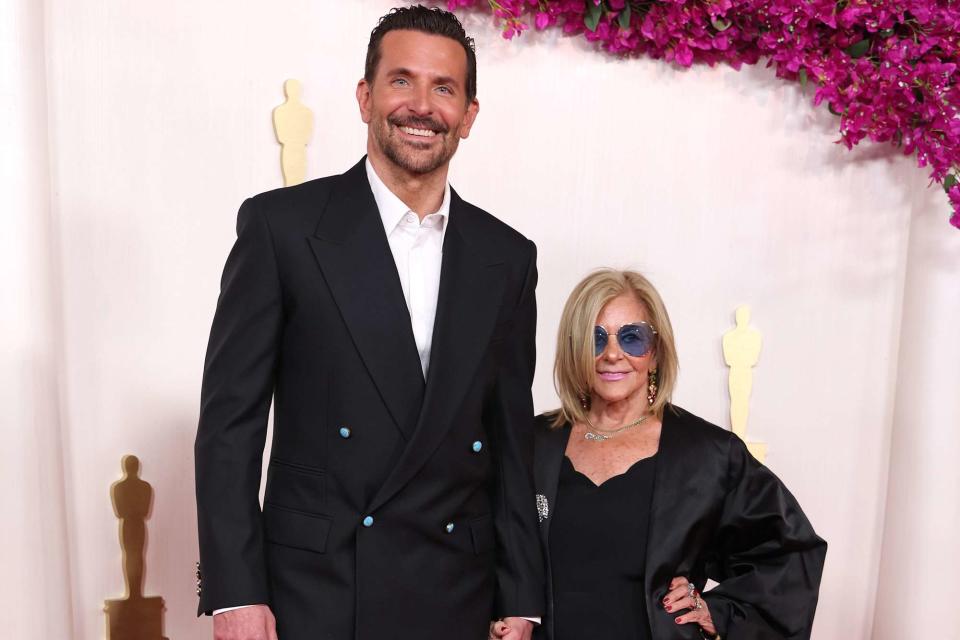 <p>Kevin Mazur/Getty</p> Bradley Cooper with his mom, Gloria Campano, at 2024 Oscars