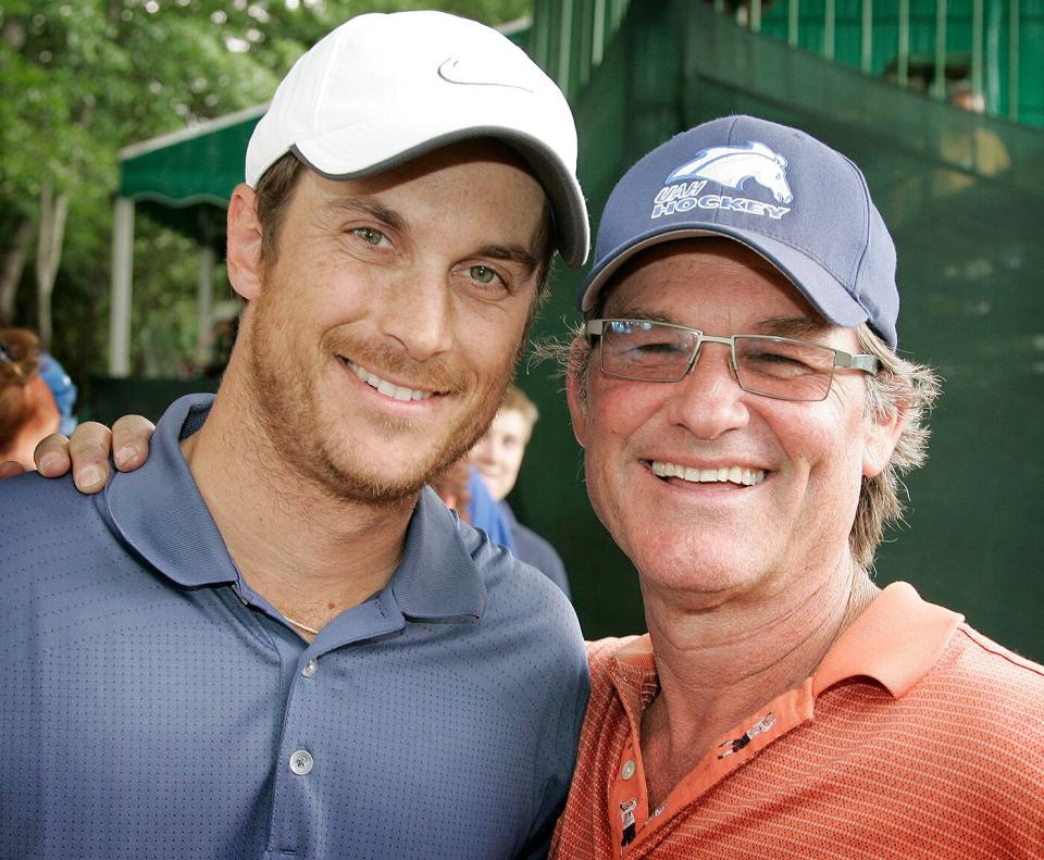 Oliver Hudson (L) and Kurt Russell pose for a photo after the second round of the BMW Charity Pro-Am at Thornblade Club held on May 16, 2008