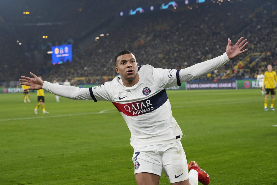 PSG's Kylian Mbappe celebrates after scoring a goal that was later disallowed during the Champions League Group F soccer match between Borussia Dortmund and Paris Saint-Germain at the Signal Iduna Park in Dortmund, Germany, Wednesday, Dec. 13, 2023. (AP Photo/Martin Meissner)