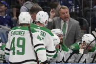 Dallas Stars head coach Rick Bowness talks to his players during the third period of an NHL hockey game against the Tampa Bay Lightning Saturday, Jan. 15, 2022, in Tampa, Fla. (AP Photo/Chris O'Meara)