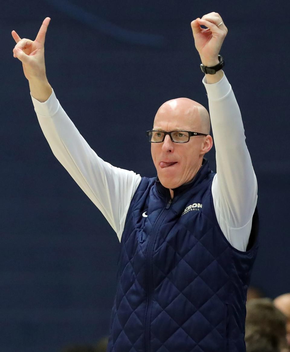 Akron coach John Groce calls plays from the bench Tuesday in Akron.