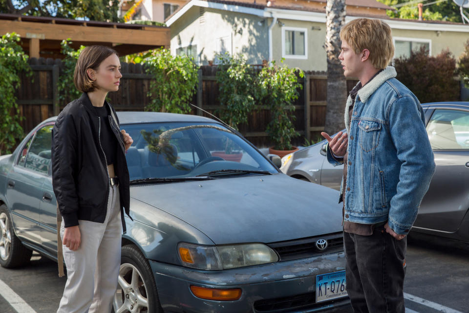 Evan and Casey standing in a parking lot