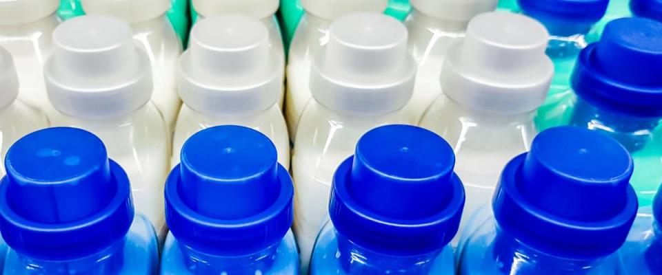 Color plastic bottles in a row.