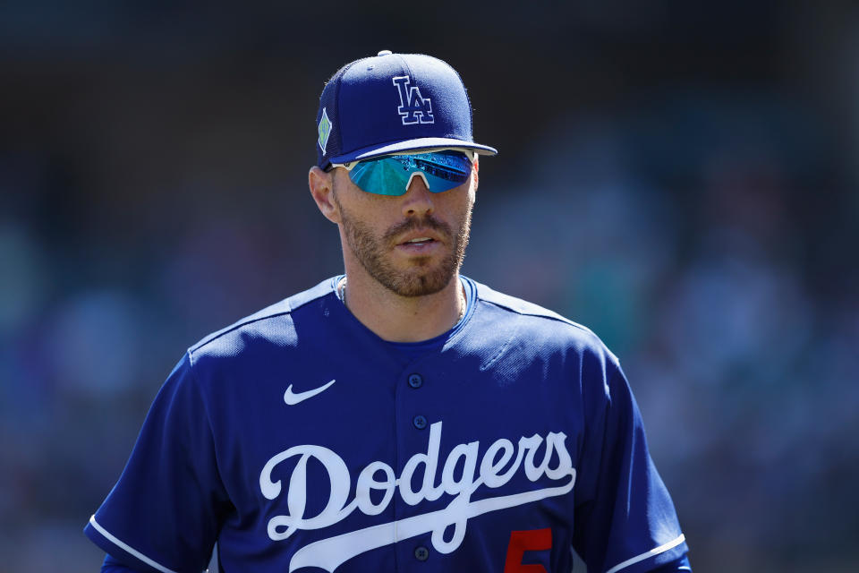 SCOTTSDALE, ARIZONA - MARCH 24: Infielder Freddie Freeman #5 of the Los Angeles Dodgers walks to the dugout during the second inning of the MLB spring training game against the Colorado Rockies at Salt River Fields at Talking Stick on March 24, 2022 in Scottsdale, Arizona. (Photo by Christian Petersen/Getty Images)