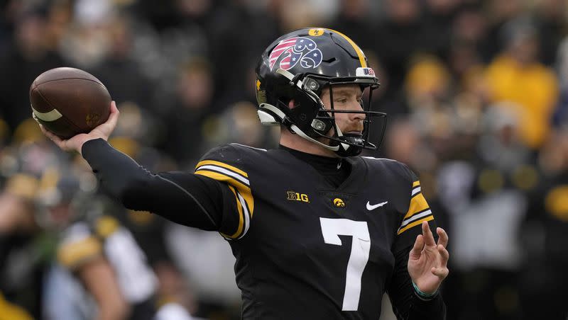Iowa quarterback Spencer Petras throws a pass during the first half of an NCAA college football game against Wisconsin, Saturday, Nov. 12, 2022, in Iowa City, Iowa. 