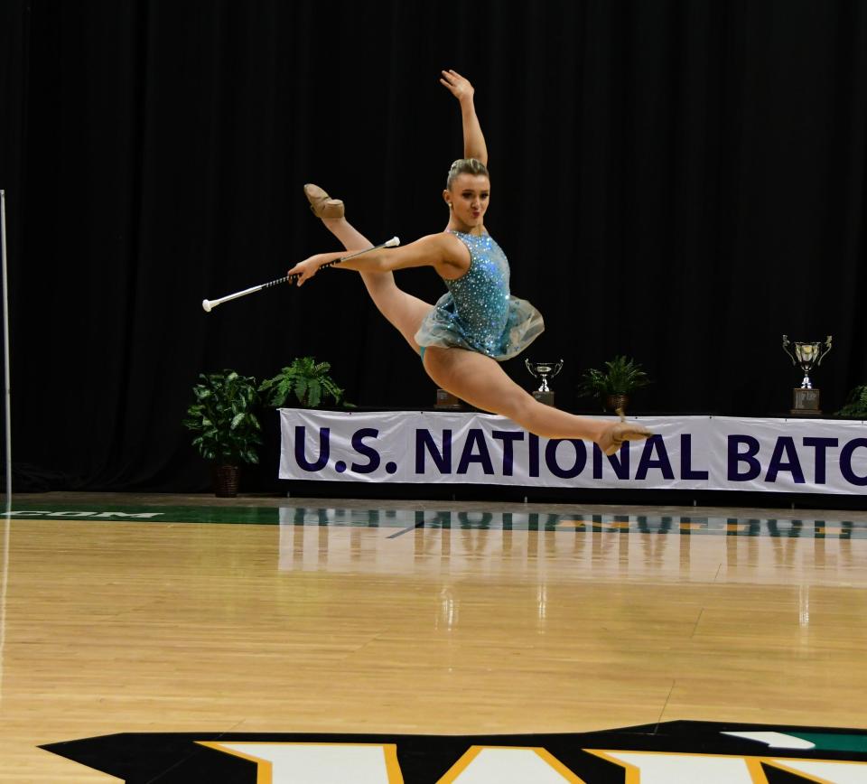 Laney Puhalla is shown competing in a national competition in 2019, when she was the grand national strut champion.