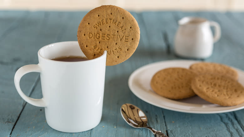 Dunking British digestives into cup of tea