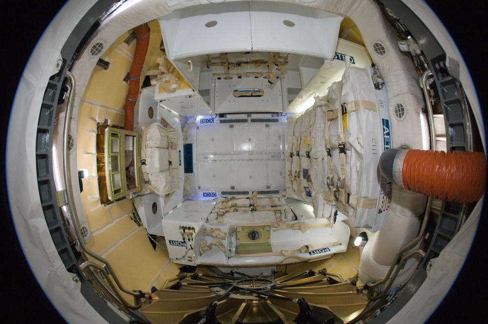 Fisheye image of the inside of a fully loaded SpaceX Dragon cargo spacecraft, such as the type used to launch supplies to the International Space Station and bring equipment back to Earth.