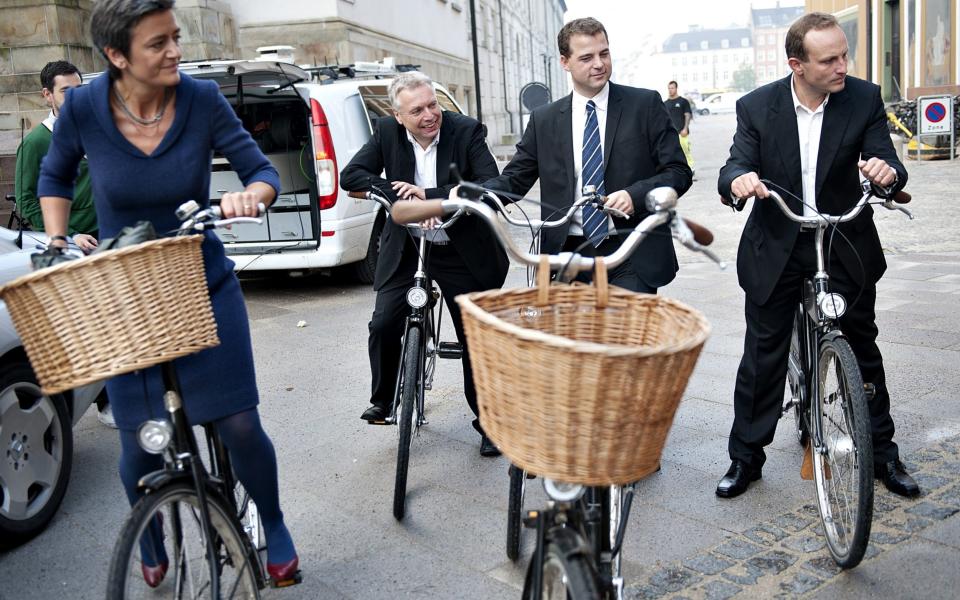 Danish ministers pose on bikes en route to the Royal Castle - AFP