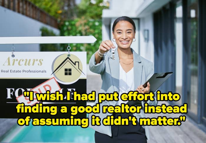 real estate agent smiling next to a sign that says sold