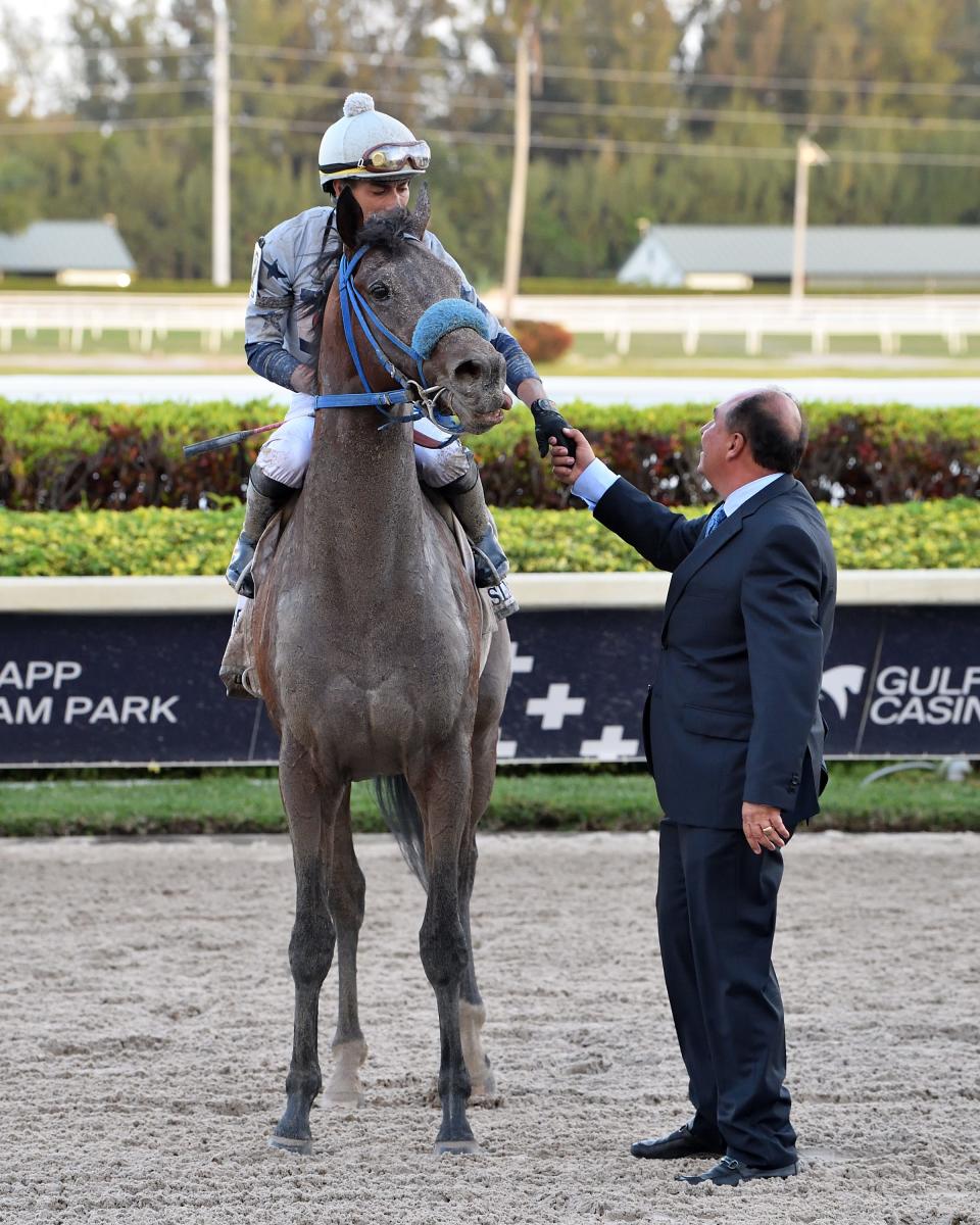 Trainer Antonio Sano greets Simplification and jockey Jose Ortiz after their victory in the Fountain of Youth on March 5 at Gulfstream Park.