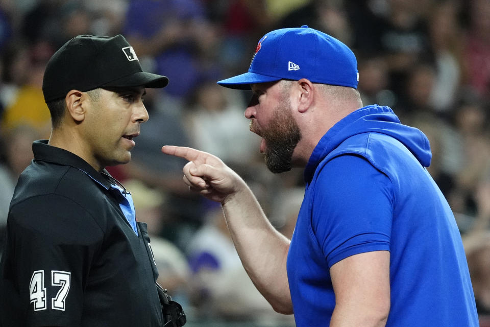 Toronto Blue Jays manager John Schneider, right, argues with home plate umpire Gabe Morales (47) after Schneider was thrown out during the seventh inning of a baseball game against the Arizona Diamondbacks, Sunday, July 14, 2024, in Phoenix. (AP Photo/Ross D. Franklin)