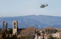 <p>A military helicopter flies over the village of Trebes after a hostage situation in a supermarket, France, March 23, 2018. (Photo: Jean-Paul Pelissier/Reuters) </p>
