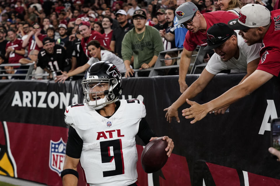 Atlanta Falcons quarterback Desmond Ridder (9) celebrates his touchdown against the Arizona Cardinals during the second half of an NFL football game, Sunday, Nov. 12, 2023, in Glendale, Ariz. (AP Photo/Ross D. Franklin)