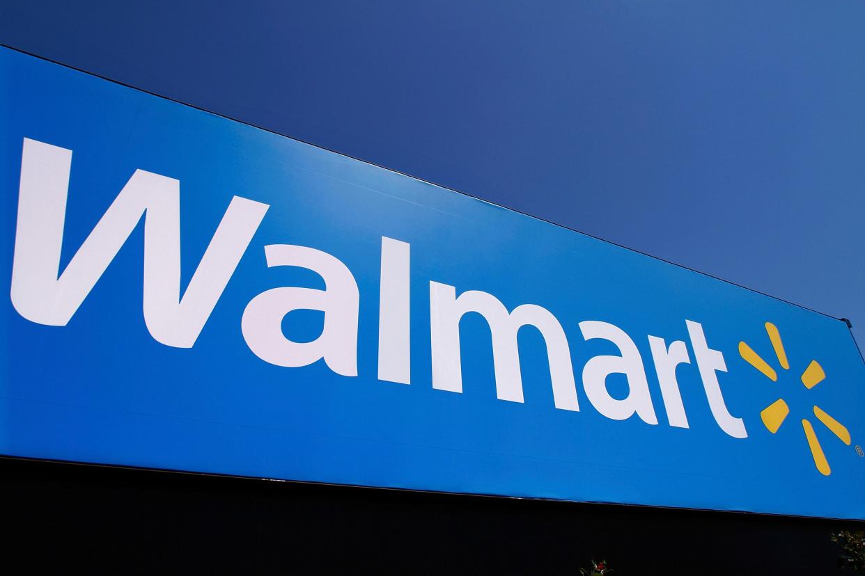 The Walmart logo is displayed on a store in Springfield, Illinois.