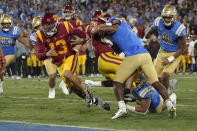 Southern California quarterback Caleb Williams (13) runs in for a touchdown during the first half of an NCAA college football game against UCLA Saturday, Nov. 19, 2022, in Pasadena, Calif. (AP Photo/Mark J. Terrill)
