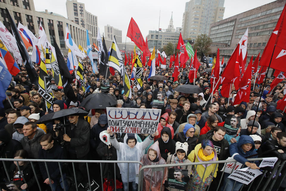 A protester holds a banner reading “Freedom to political prisoners! They haven’t to be arrested!” during a rally to support political prisoners in Moscow, Russia, Sunday, Sept. 29, 2019. (AP Photo/Dmitri Lovetsky)