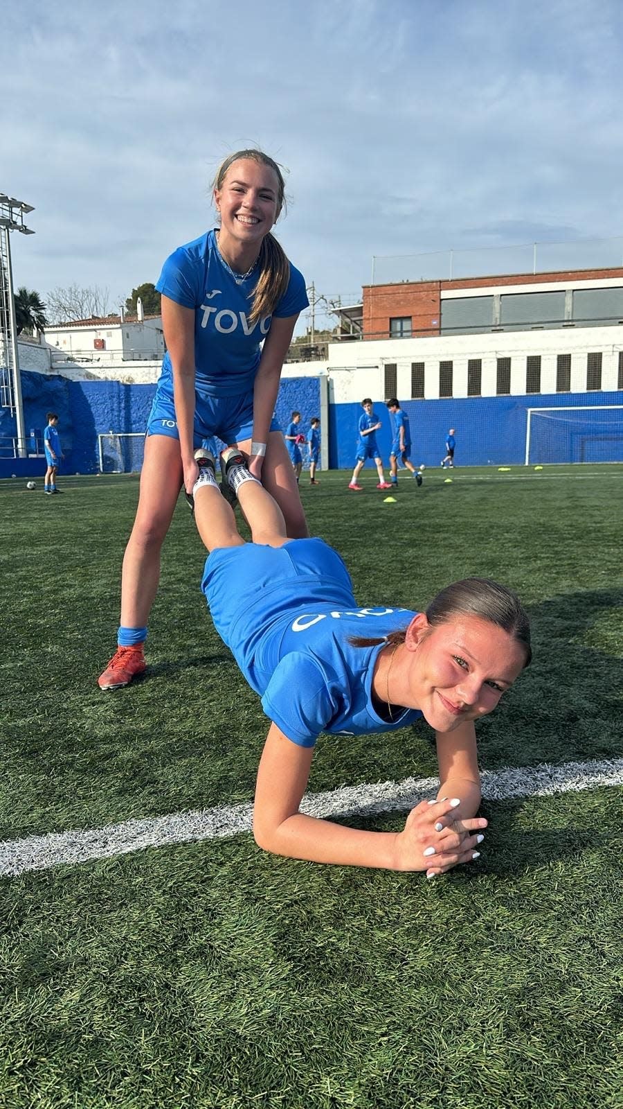 Leah Schamberg and teammate Lucy Lundblad perform a "dual force" exercise during soccer warmups while at the TOVO Academy in Spain.