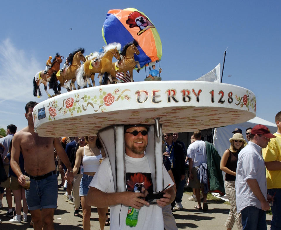 Tony Offlutt&nbsp;of New Albany, Indiana, wears a huge derby-themed hat at Churchill Downs on May 4, 2002.
