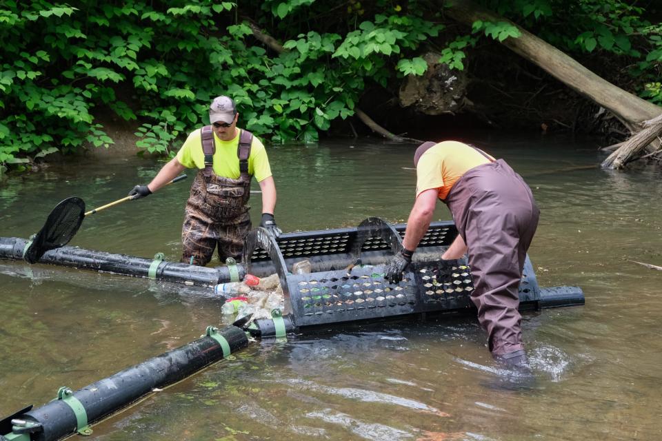 The new device in the Green Brook will catch litter and debris to reduce pollution.