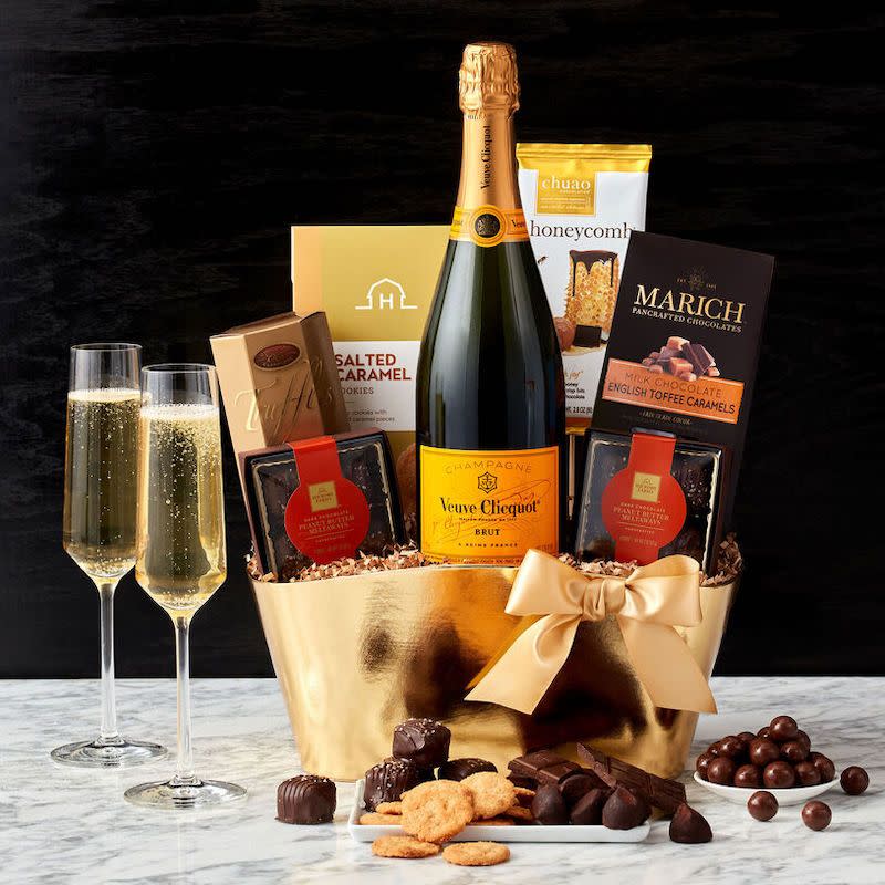 <p><a href="https://go.redirectingat.com?id=74968X1596630&url=https%3A%2F%2Fwww.hickoryfarms.com%2Fgift-baskets%2Fwine%2Fveuve-clicquot-champagne-gift-basket-007667.html%3Fgridindex%3D15%26cgid%3Dwine-gifts%23start%3D1&sref=https%3A%2F%2Fwww.esquire.com%2Ffood-drink%2Fg38036473%2Fbest-wine-gift-baskets%2F" rel="nofollow noopener" target="_blank" data-ylk="slk:Shop Now;elm:context_link;itc:0;sec:content-canvas" class="link ">Shop Now</a></p><p>Veuve Clicquot Champagne Gift Basket</p><p>$195.00</p><p>hickoryfarms.com</p>