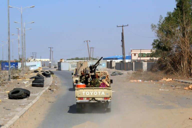 Yemeni pro-government forces drive through the eastern outskirts of Hodeida on November 13, 2018