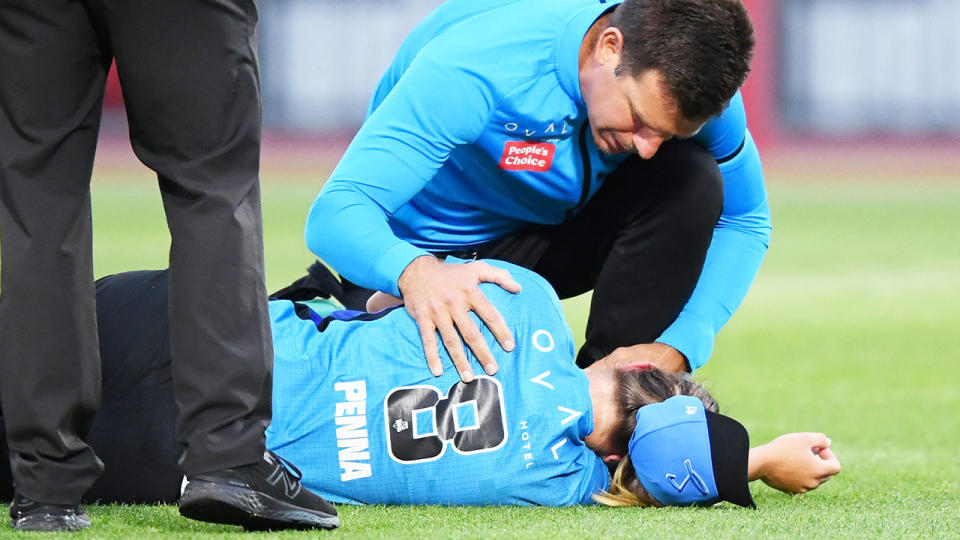 Maddie Penna, pictured here after being struck in the face during the Adelaide Strikers' clash with Sydney Thunder.