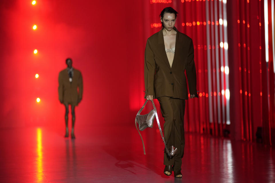 A model wears a creation as part of the Jordanluca men's and women's Spring Summer 2024 collection, unveiled during the Fashion Week in Milan, Italy, Saturday, June 17, 2023. (AP Photo/Antonio Calanni)