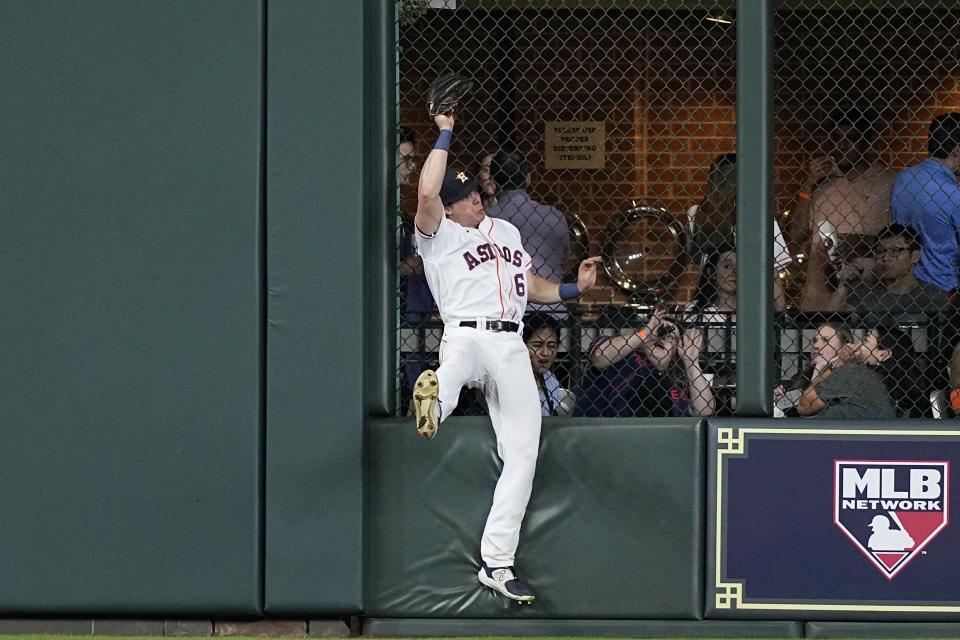 Houston Astros center fielder Jake Meyers catches a fly ball by Washington Nationals' Dominic Smith during the seventh inning of a baseball game Tuesday, June 13, 2023, in Houston. (AP Photo/David J. Phillip)
