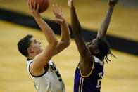 Iowa center Luka Garza shoots over Western Illinois forward Tamell Pearson, right, during the first half of an NCAA college basketball game, Thursday, Dec. 3, 2020, in Iowa City, Iowa. (AP Photo/Charlie Neibergall)