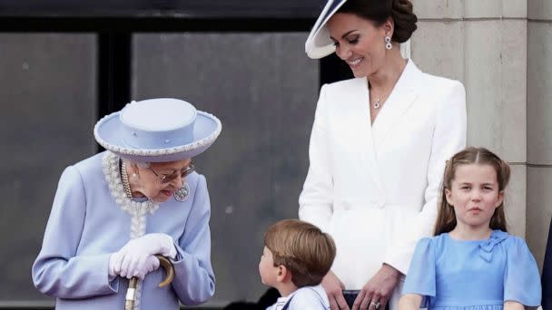 PHOTO: Queen Elizabeth II, Kate, Duchess of Cambridge, Prince Louis, Princess Charlotte watch from the balcony of Buckingham Place after the Trooping the Color ceremony in London, June 2, 2022. (Aaron Chown/AP)