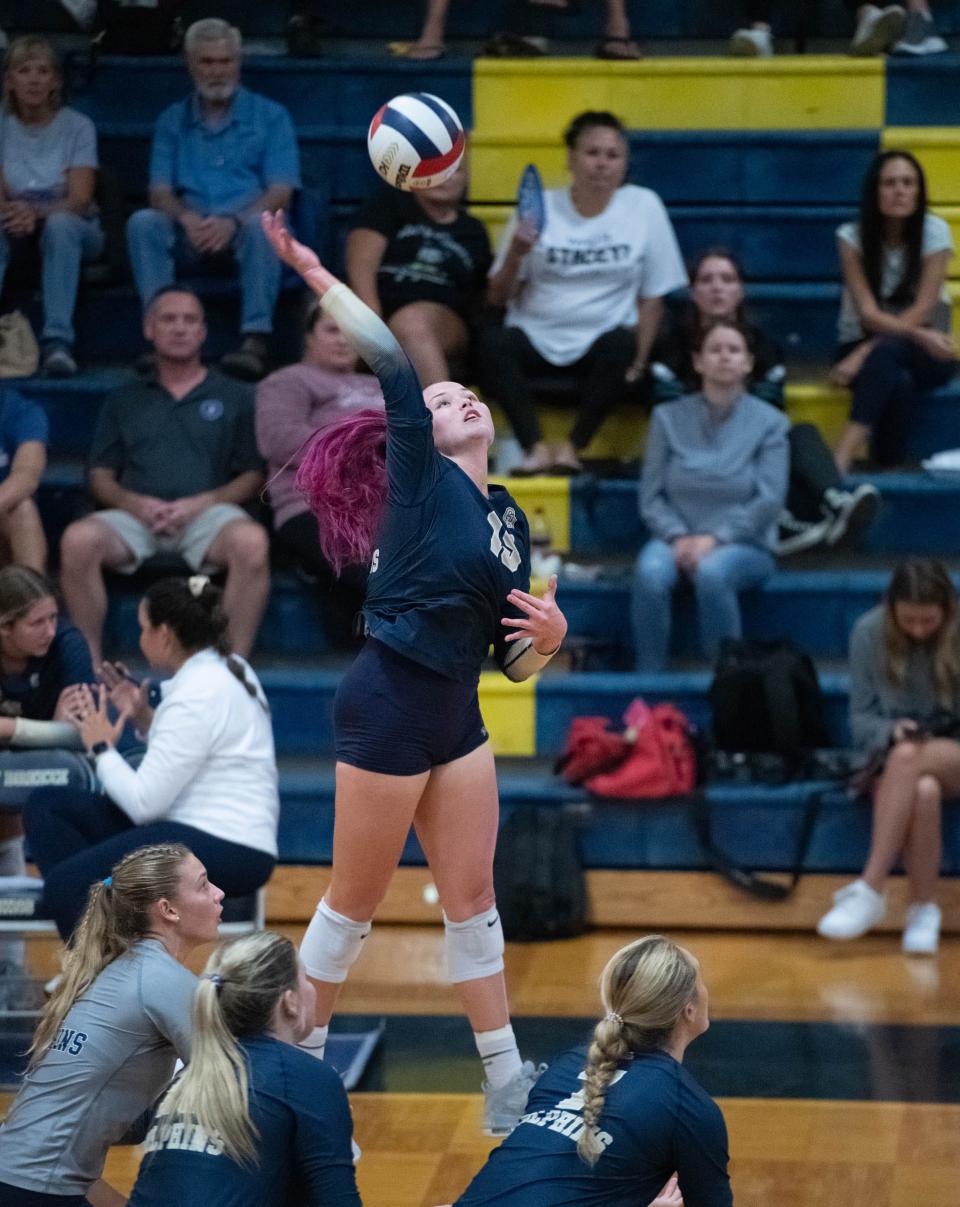 Bella Satterwhite (15) plays the ball during the Navarre vs Gulf Breeze volleyball match at Gulf Breeze High School on Thursday, Sept. 28, 2023.