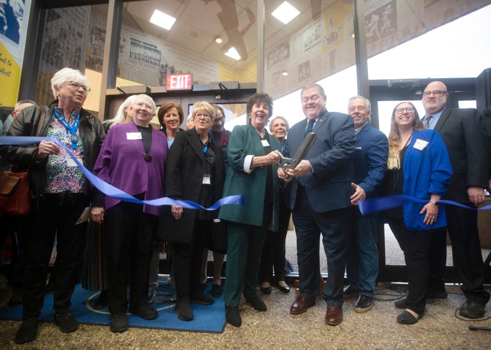 Wayland Baptist University's president Bobby Hall and former Queen Linda Pickens Price cut the ribbon for the Flying Queens Museum in Plainview Saturday.