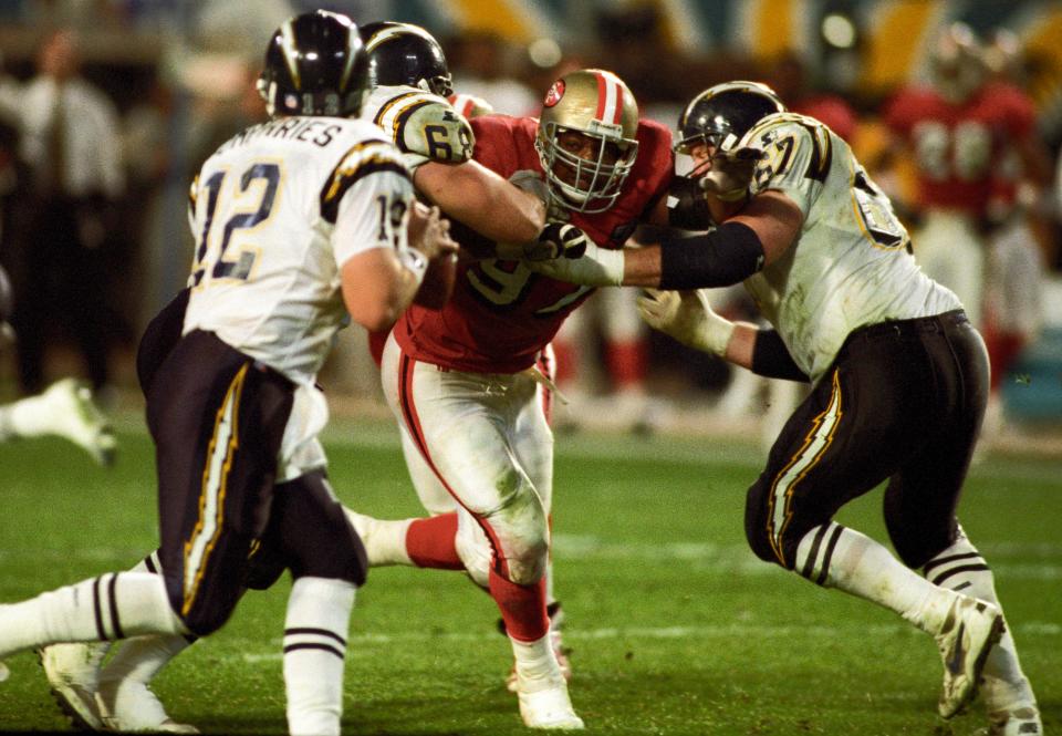 San Francisco 49ers defensive tackle Bryant Young (97) in action against the San Diego Chargers in Super Bowl XXIX, in Miami, Jan. 29, 1995. San Francisco won 49-26.