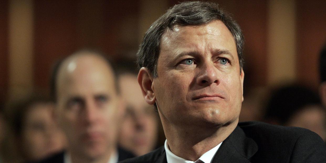 Supreme Court Chief Justice John Roberts listens as President Bush speaks at the National Prayer Breakfast in Washington Friday, April 7, 2006.