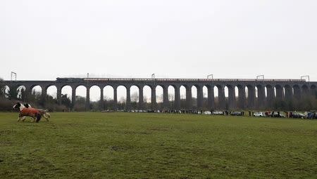 The Flying Scotsman steam engine passes over Digswell Viaduct as it makes it's official return after a restoration project, near Welwyn Garden City, southern England, February 25, 2016. REUTERS/Eddie Keogh