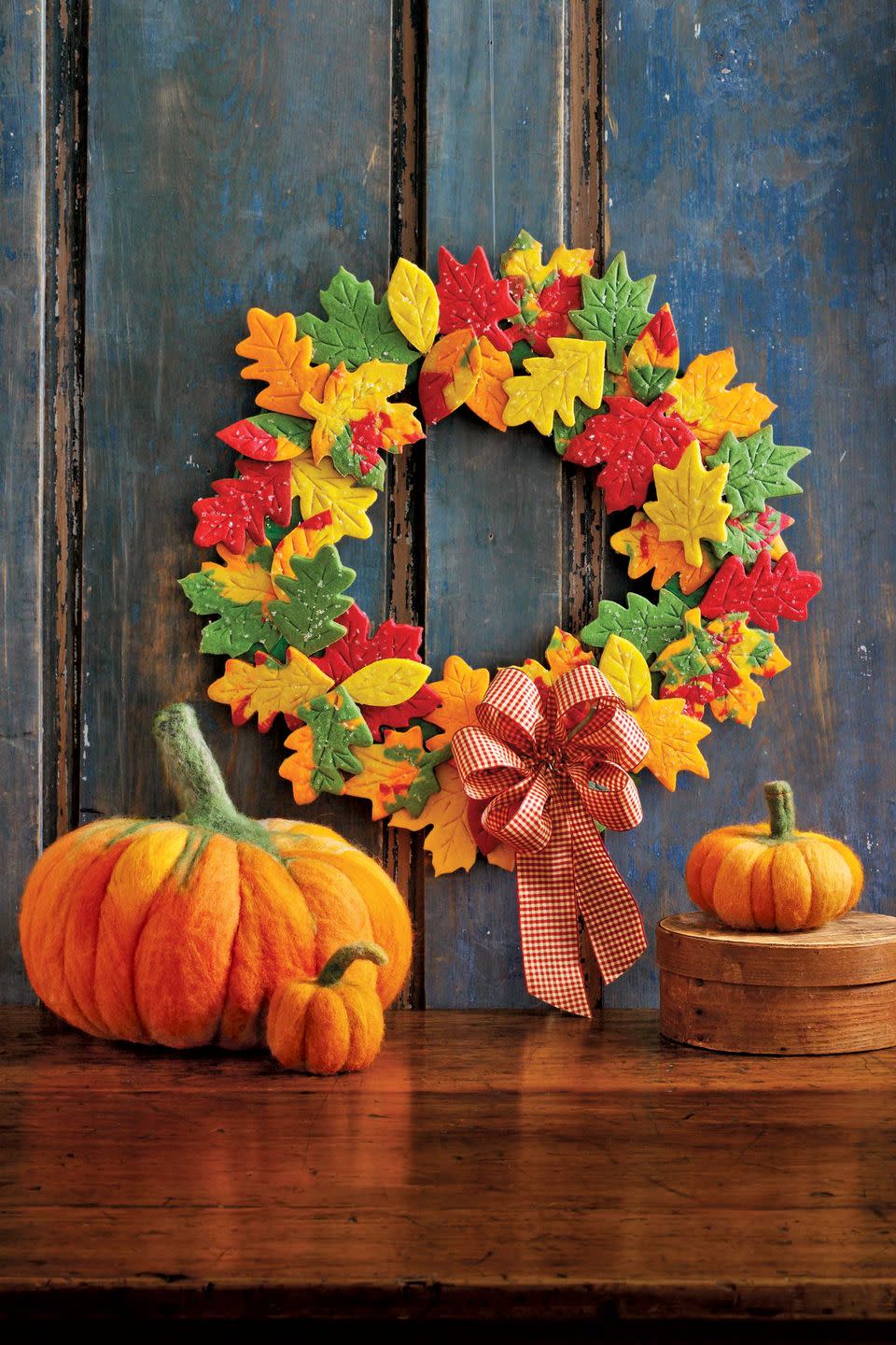 <p>Yes, you read that right. This sweet wreath is made from homemade colorful, sugar cookies. </p><p><strong>Get the tutorial at <a href="https://www.countryliving.com/diy-crafts/how-to/g1732/fall-cookie-wreath/?slide=1" rel="nofollow noopener" target="_blank" data-ylk="slk:Country Living;elm:context_link;itc:0;sec:content-canvas" class="link ">Country Living</a>.</strong> </p>