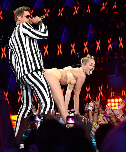miley cyrus grinds butt against robin thicke at mtv vmas 2013 performance of blurred lines.