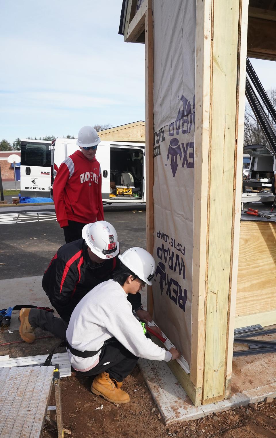 Rockland BOCES Construction Trades Instructor Frank Detoma and student Andrew Walters-Diaz install a piece of j-channel during the build of a Safety City at Rockland BOCES in West Nyack on Wednesday, November 29, 2023.