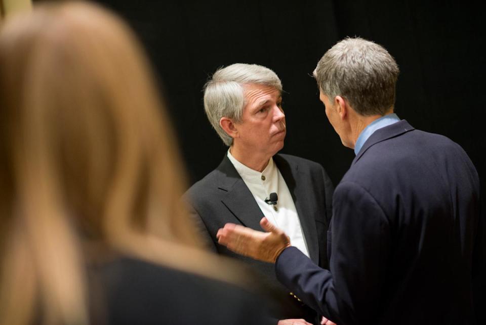 David Barton, left, of WallBuilders talks with a delegate as he poses for photos at a Texas Eagle Forum reception at the Texas Republican Convention in Fort Worth on June 7, 2012.