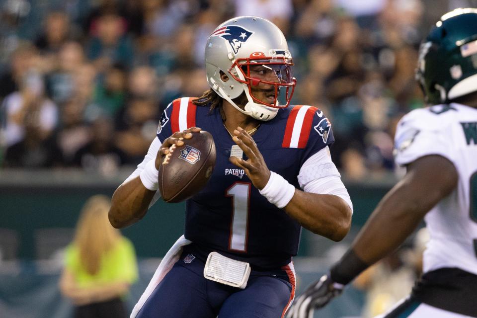 Patriots quarterback Cam Newton drops back to pass against the Eagles during the first quarter Thursday night.