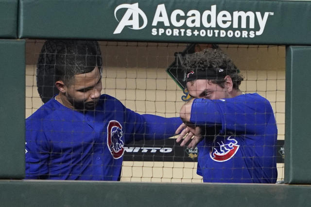 Chicago Cubs' Albert Almora Jr., right, reacts after hitting a