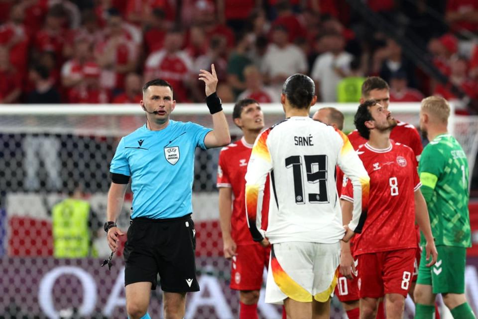 Oliver took charge of the last-16 tie between Germany and Denmark, which was briefly paused due to inclement weather (Getty Images)