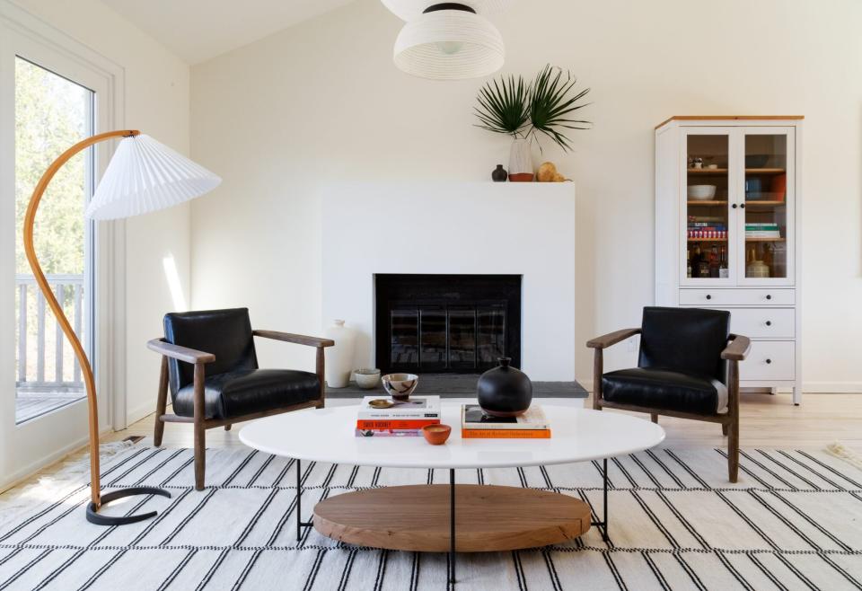 montauk home tour neutral living room with black fireplace