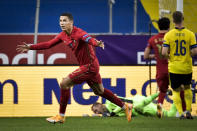 FILE - In this Sept. 8, 2020 file photo Portugal's Cristiano Ronaldo celebrates after scoring against Sweden during their UEFA Nations League soccer match at Friends Arena in Stockholm, Sweden. The Portuguese soccer federation says on Tuesday, Oct. 13 Cristiano Ronaldo has tested positive for the coronavirus. The federation says Ronaldo is doing well and has no symptoms. He has been dropped from the country's Nations League match against Sweden on Wednesday. (Janerik Henriksson / TT via AP, file)