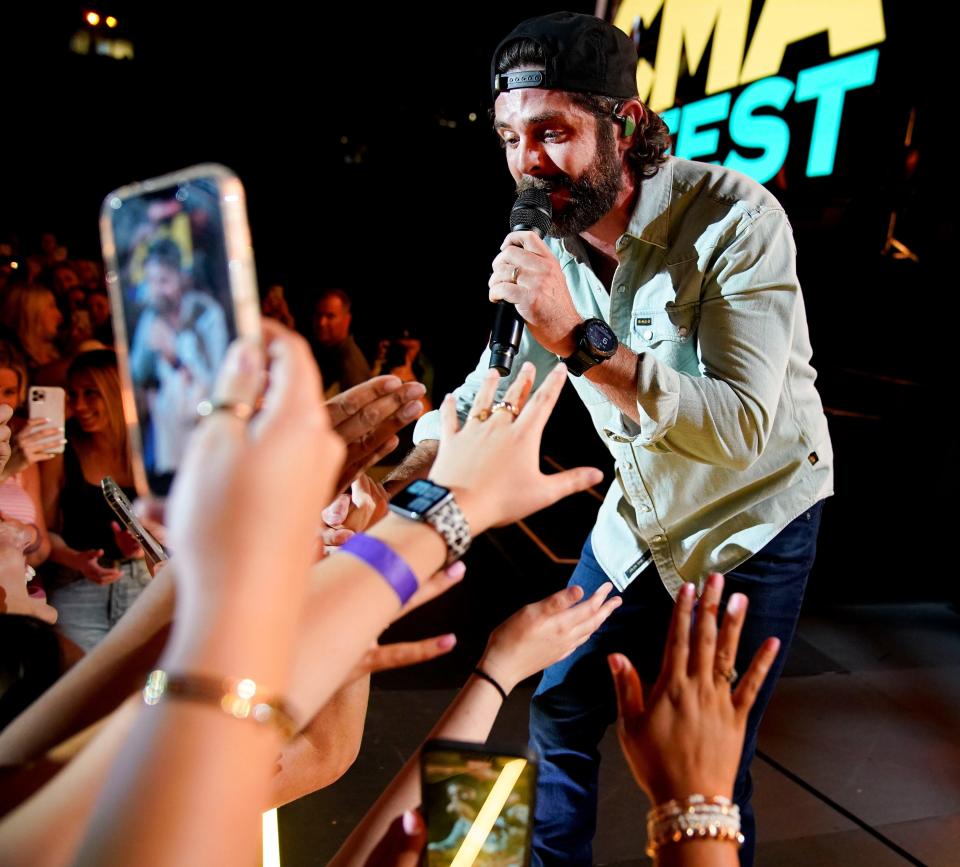 Thomas Rhett interacts with fans as he performs during CMA Fest at Nissan Stadium June 10, 2022. The festival was cancelled in 2020 and 2021 due to the COVID-19 pandemic.