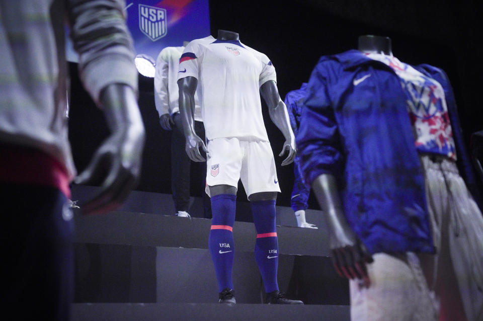 A new uniform, center, for the U.S. men's World Cup soccer team is displayed by Nike, Wednesday, Aug. 31, 2022, in New York. (AP Photo/Bebeto Matthews)