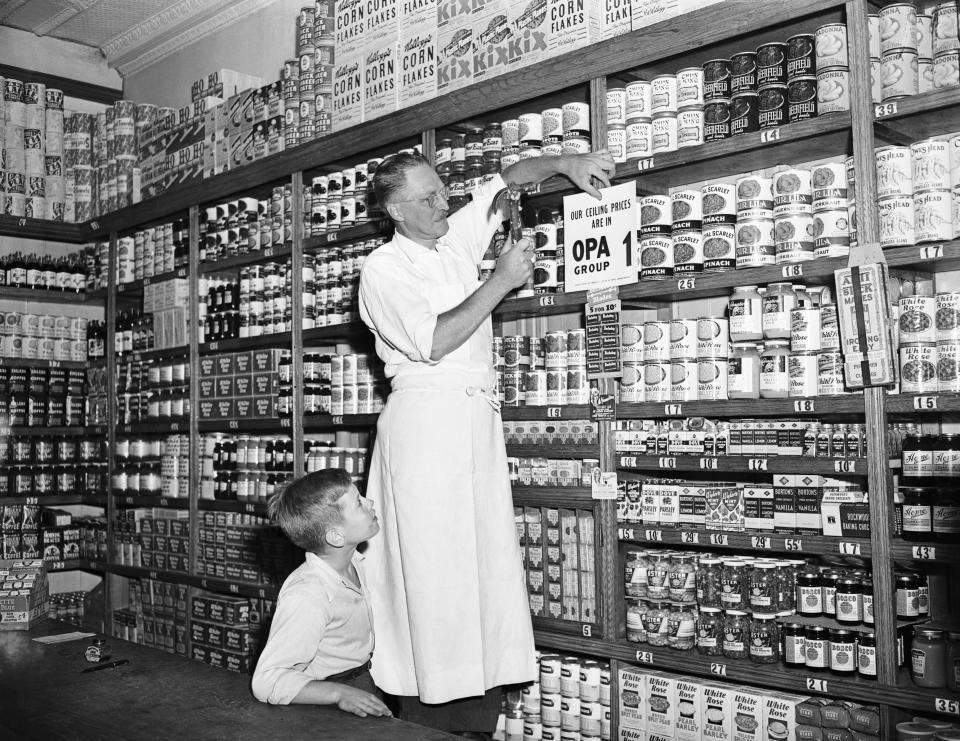 store Owner Putting Sign Up In Grocery
(Original Caption) 8/1/1946-New York, NY: Charles Zobel in the grocery department of Al's Food Market, 468 Dean St., Brooklyn, tacks up new OPA sign