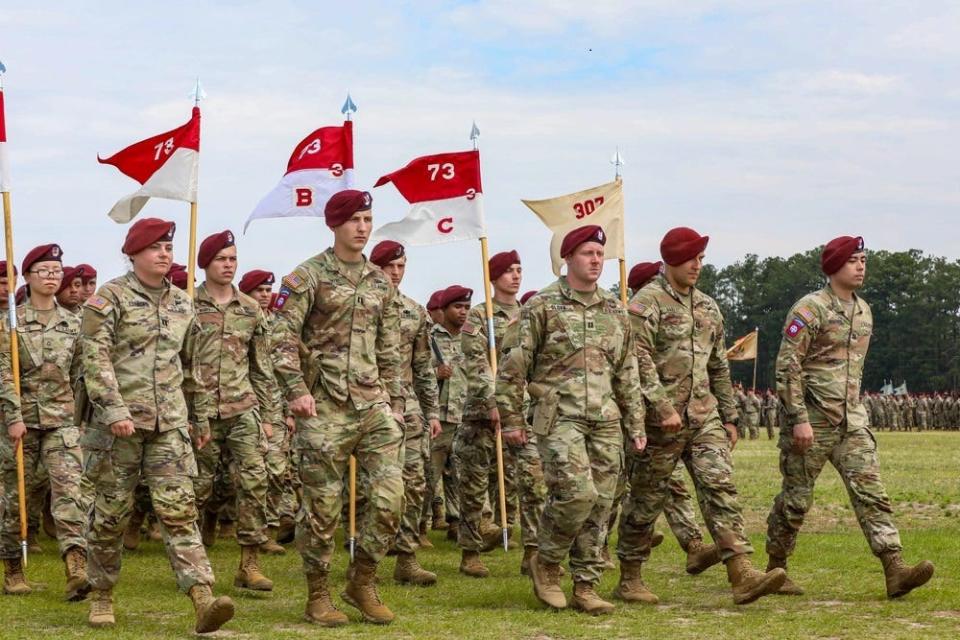 Paratroopers assigned to 3rd Squadron, 73rd Cavalry Regiment, 1st Brigade Combat Team, 82nd Airborne Division, march during a pass in review ceremony, May 25, 2023, on Pike Field during All American Week.