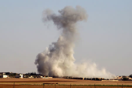 Smoke rises from airstrikes on Guzhe village, northern Aleppo countryside, Syria October 17, 2016. REUTERS/Khalil Ashawi